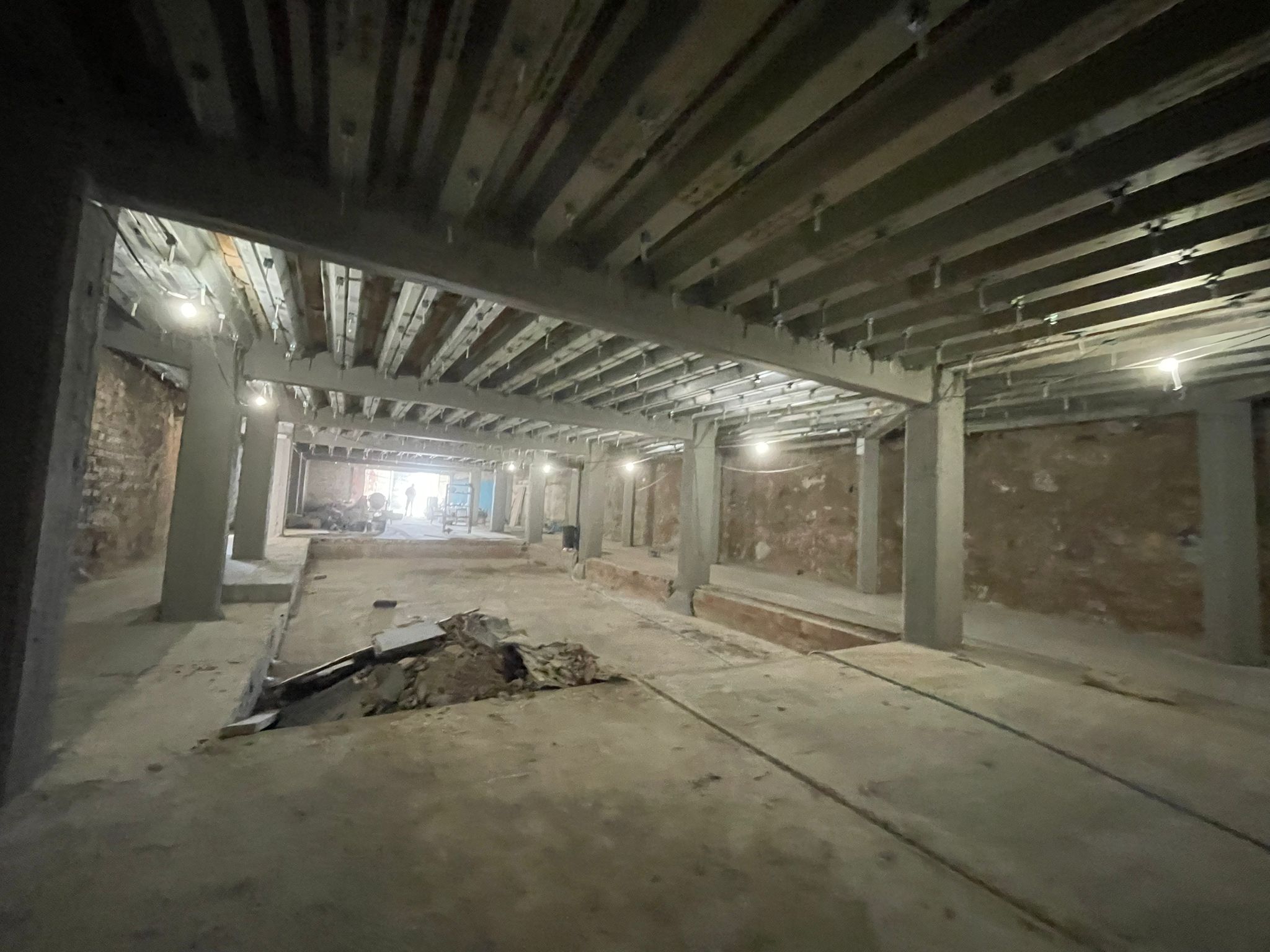 The DONDA club basement, second view: original column work and overhead steel reinforcement